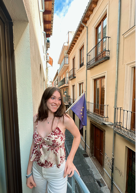 Student intern Julia Sample on a balcony in Granada, Spain