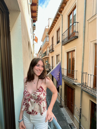 Student intern Julia Sample on a balcony in Granada, Spain