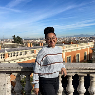 Student intern Rachel McGinnis on a balcony in Rome